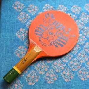 Greek Alpha Vintage Wooden Racket With Black Tiger Image On Orange Background